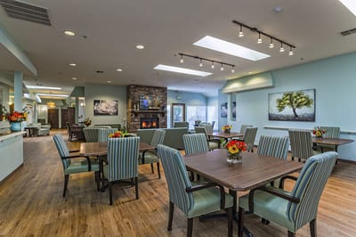 Bright and spacious dining area with tables and chairs