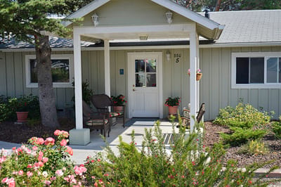 Exterior view of a welcoming entrance with flowers