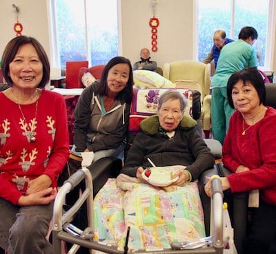 Residents and staff interacting in a common area