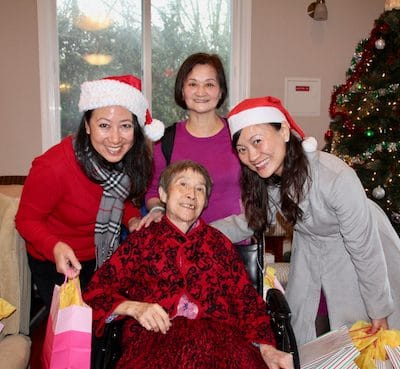 Residents and staff celebrating with gifts