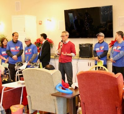 Residents and staff engaging in a lively activity
