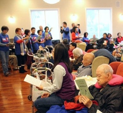 Residents participating in an activity with staff assistance