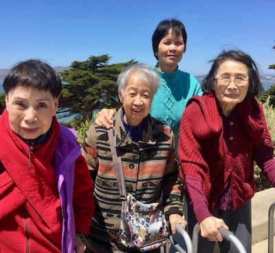 Four seniors enjoying the outdoor view together