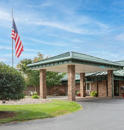 Exterior view of Valley Pines facility with flag