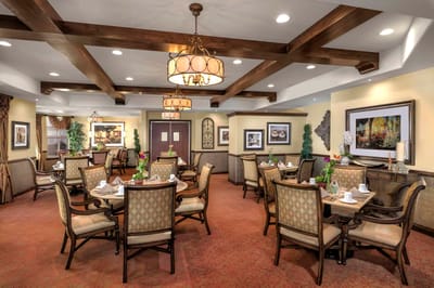Dining room setup with tables and chairs