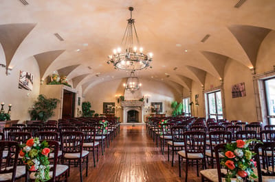 Elegant interior of a banquet hall with rows of chairs