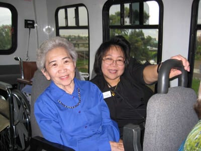 Residents enjoying a ride in a facility vehicle