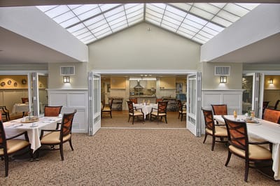 Bright dining area with tables and chairs