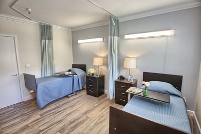 Two neatly arranged resident rooms with modern decor
