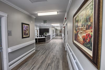 Bright corridor with artwork and floral decorations