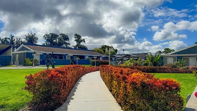 Pathway through landscaped gardens in a senior living facility