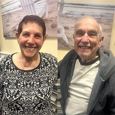 Two smiling residents in a common area