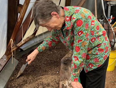 Resident gardening in a greenhouse