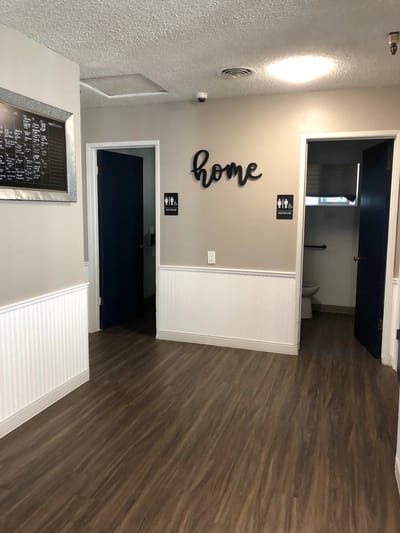 Interior hallway with the word 'home' on the wall