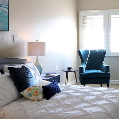 Cozy resident room with a bed and a chair