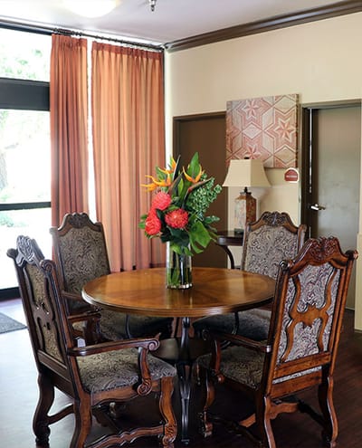 Cozy common area with a table and flowers