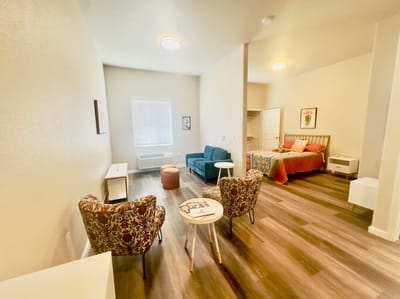 Interior view of a spacious resident room with furniture