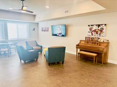 Interior common area with seating and a piano