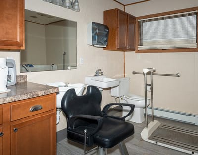 Interior view of a facility bathroom with equipment