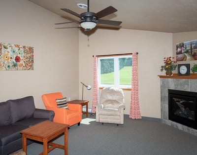 Comfortable common area with seating and a fireplace