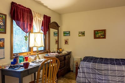 Cozy private resident room with bed and desk