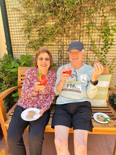 Residents enjoying refreshments in a garden space