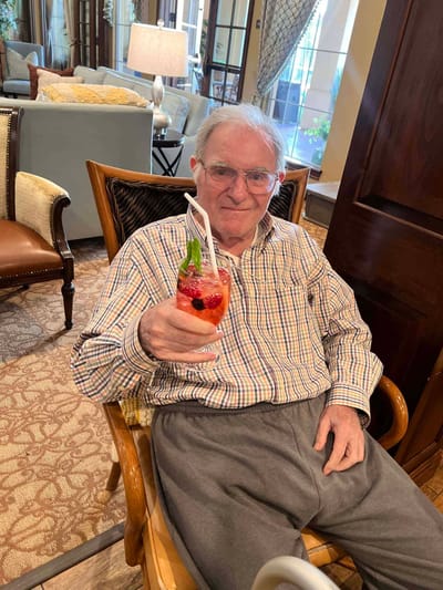 Resident enjoying a drink in the common area