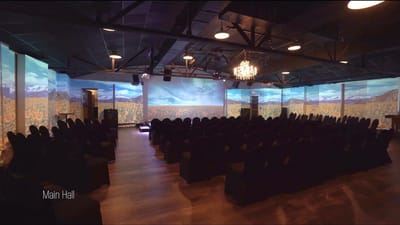Interior view of the main hall with seating and projections