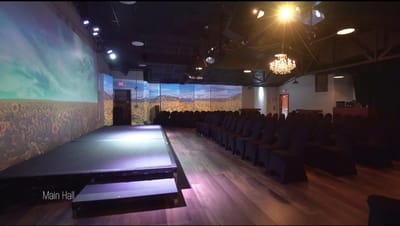 Interior view of a main hall with seating and stage