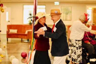 Residents dancing at a festive activity event
