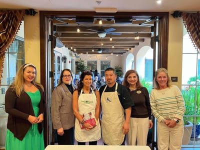 Staff and participants in a bright common area event