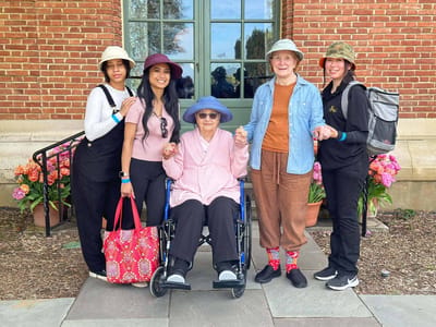 Residents and staff enjoying outdoor time together