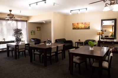 Bright common area with tables and seating