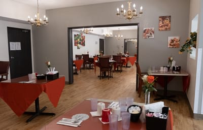 Interior of a cozy dining room with tables set