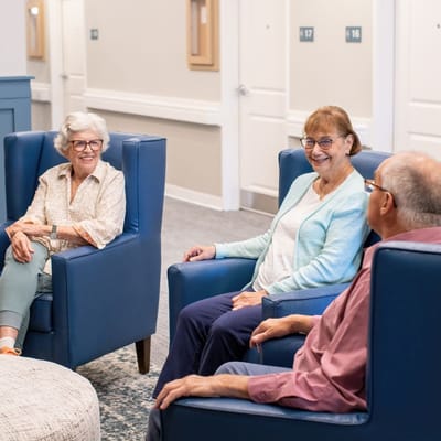 Residents socializing in a comfortable lounge area