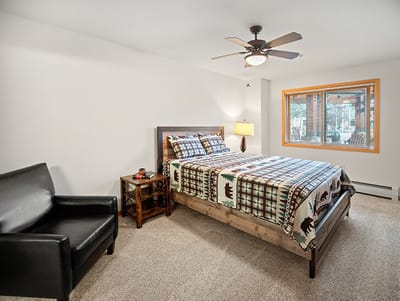 Bright, cozy resident room with a bed and chair