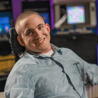 Smiling resident in an activity room setting
