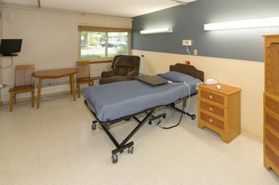 Simple resident room with a bed and furniture