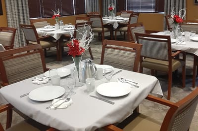 Dining area set with plates and decorations