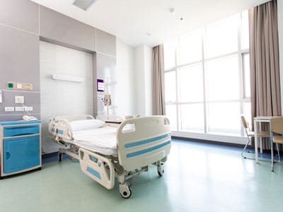 Bright and clean hospital room with a bed