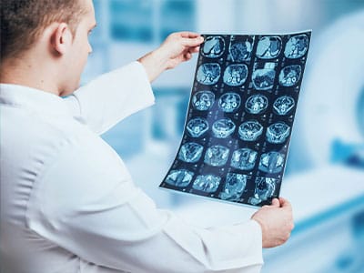 Doctor examining medical imaging in a clinical setting