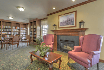 Cozy common area with bookshelves and seating
