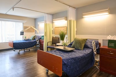 Private resident room with hospital beds and decor