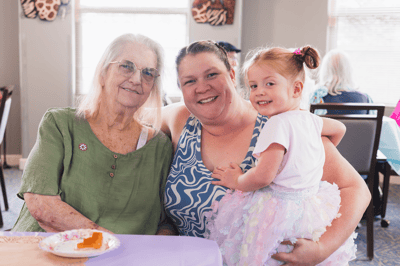 Family members enjoying a meal together in a common area