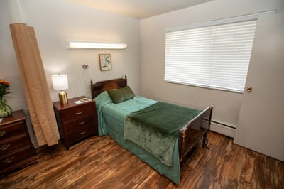 Cozy resident bedroom with natural light