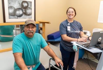 Residents participating in therapy with staff assistance