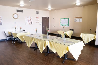 Dining area with tables and flower decorations
