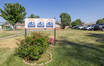 Facility logo displayed outside with landscaping