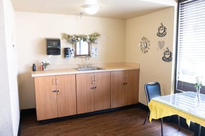 Bright interior kitchenette with cabinet and decor