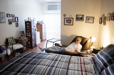 Resident relaxing in a well-decorated private room